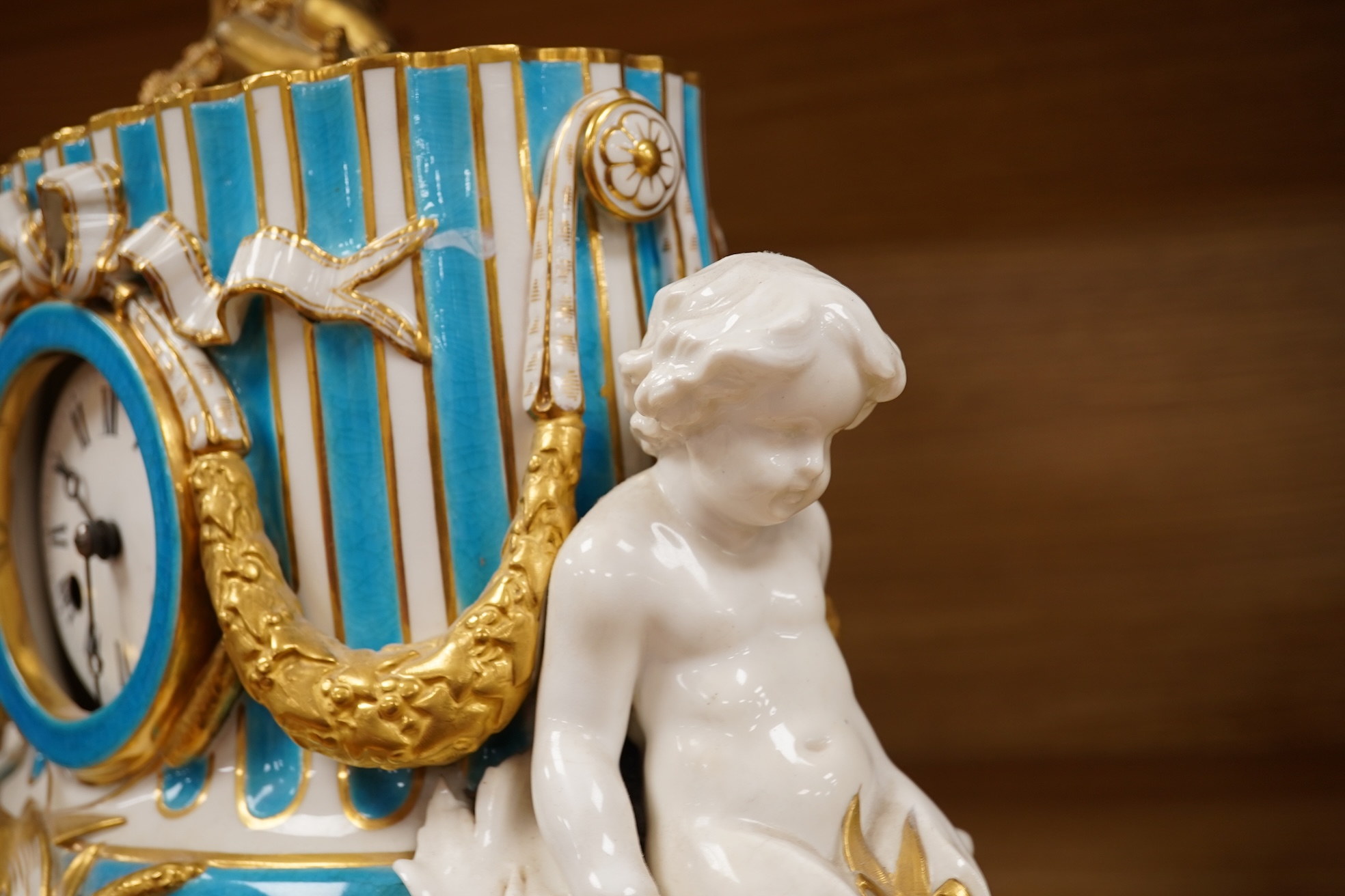 A 19th-century Sevres style porcelain mantel clock, 29cm tall